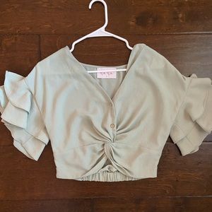 Green ruffle sleeve top. Size small.